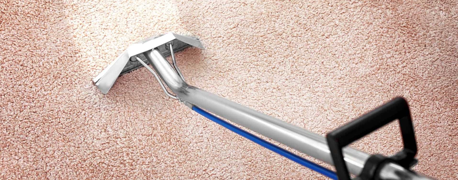 removing dirt from carpet with professional vacuum