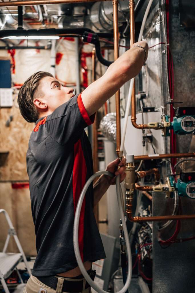Furnace in Calgary home being professionally cleaned by Big Ben Cleaning